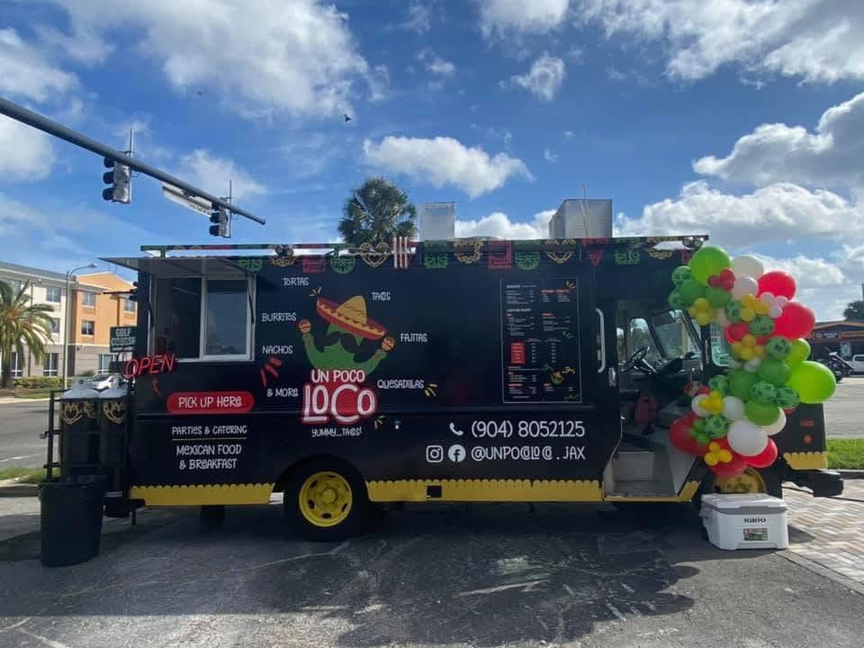 The black Un Poco Loco food truck with yellow accents and the cactus-in-sombrero logo